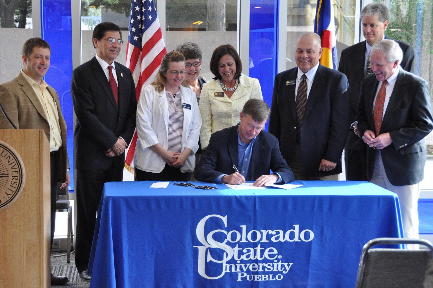 Gov. Hickenlooper signs bill at CSU-P