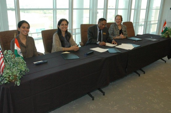 Peg Bacon and Dandapani sign the MOU