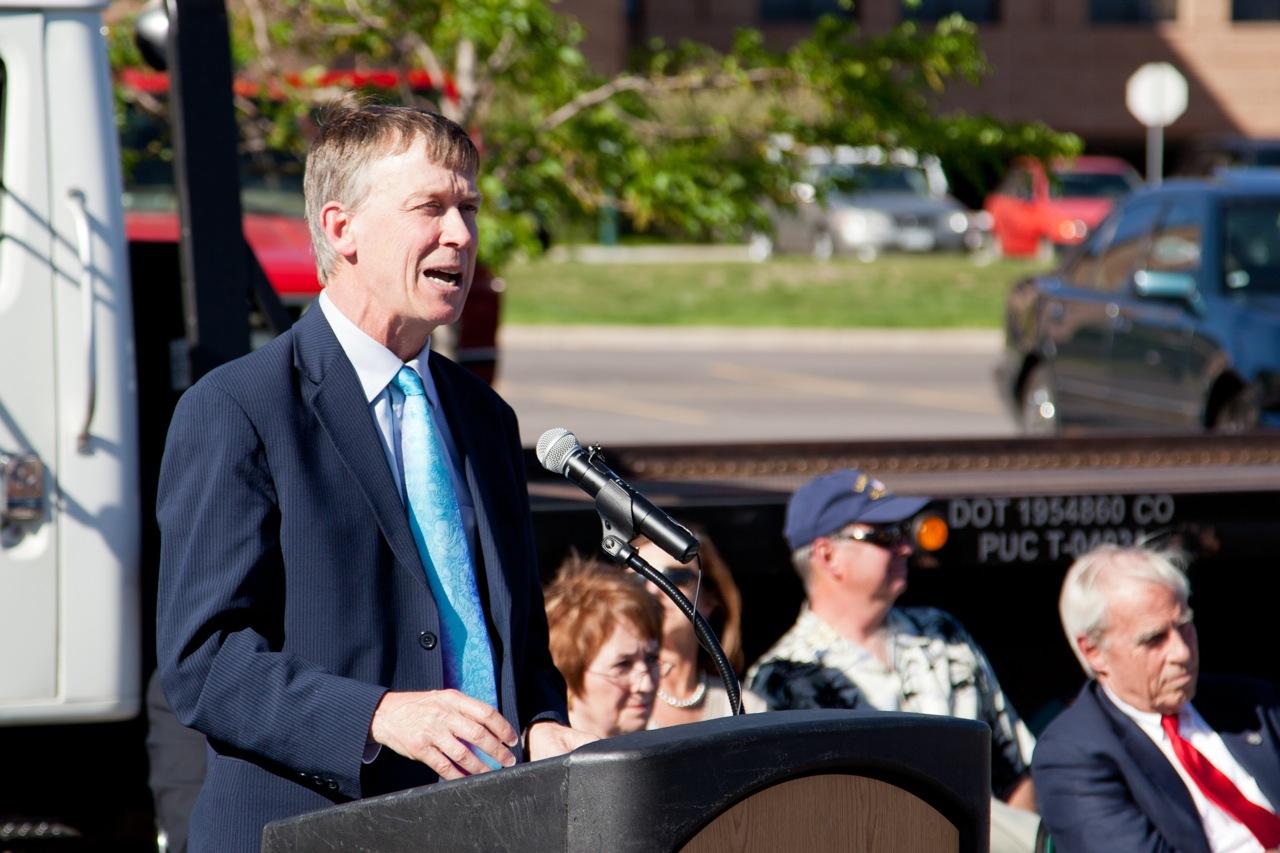 CO Governor Hickenlooper at a podium