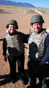 Dean Mary Snyder, left, and Dean Peter Braza, right, learn first-hand about the life of a soldier.