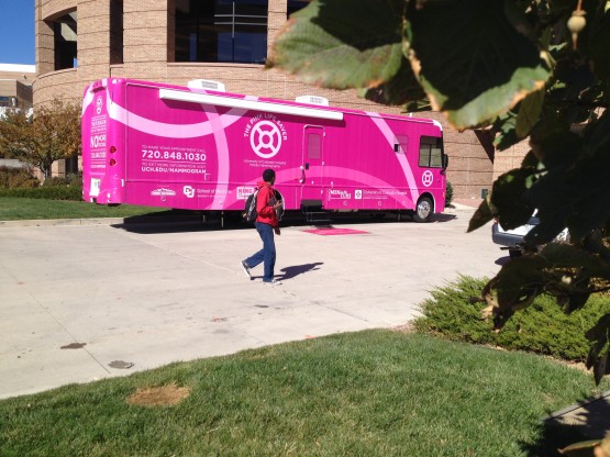 A student checks out the University of Colorado Hospital's Pink Life Saver during Be Colorado health screenings Oct. 22.
