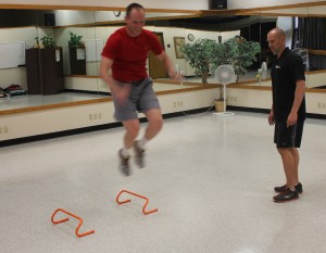 Jeremy Simenson, left, is coached by Jay Dawes during a recent session at University Hall.