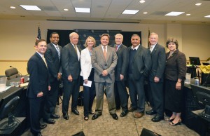 Brian Burnett, center, was honored by the CU Board of Regents for his 11 years of service June 27.