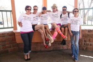 A group who participated in the 2013 Walk A Mile event show off their shoes.  Photo by Dennis Wagner