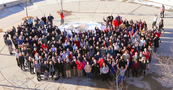 Faculty and staff gather on El Pomar Plaza to recreate photo from 25th anniversary