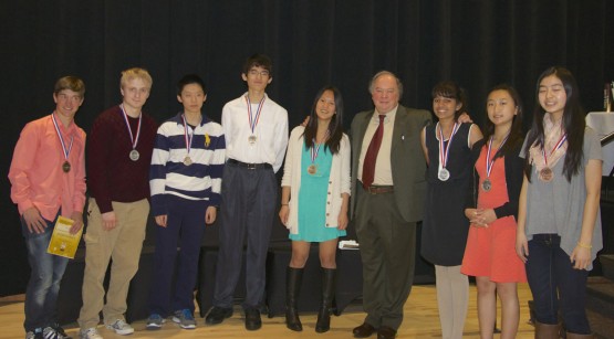 Alexander Soifer, Colorado Math Olympiad chair and professor, Interdepartmental Studies, poses with this year's winners