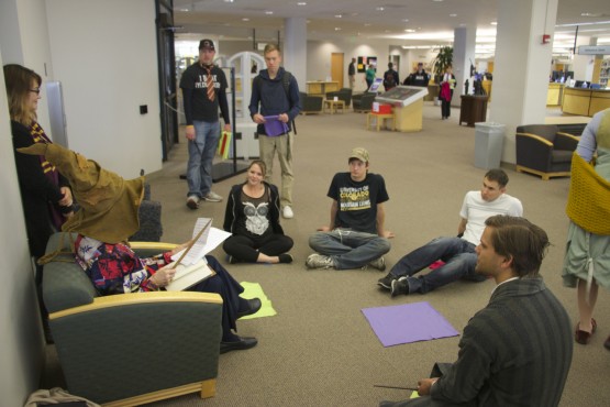 Students took a break from studying to listen to seniors from MacKenzie Place retirement community read stories