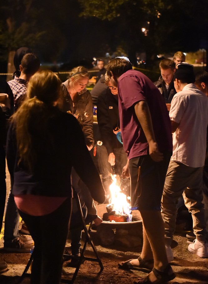 Students roast s’mores during the bonfire