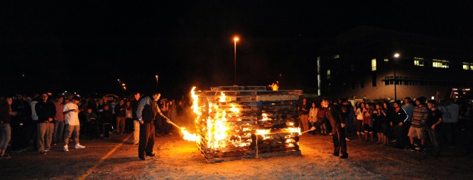 Hundreds of students and community members warmed themselves around the bonfire