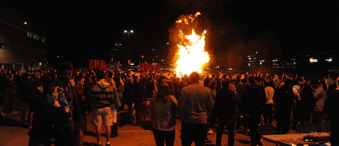 Hundreds of students and community members warmed themselves around the bonfire