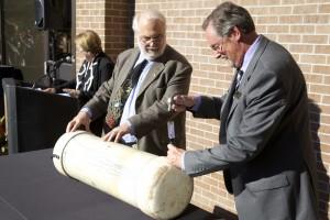 Jeff Davis, executive director, Auxiliary Operations and Steve Gnadt, former director, University Center, open the 1988 time capsule