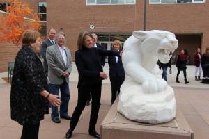 Johnson Foundation Trustee Lynn Campion touches the marble mountain lion during a Nov. 6 campus tour.