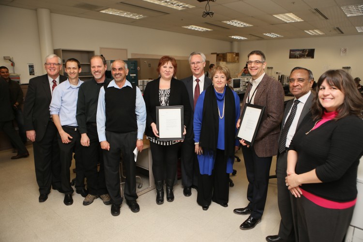 UCCS and Keysight Technology leaders celebrate the company's gift of new electronic measurement equipment.