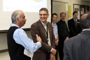 T.S. Kalkur, professor, College of Engineering, converses with Dave Cipriani of Keysight Technologies following a March 28 presentation.