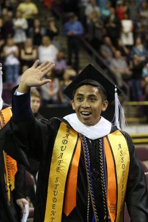 Raymond Fisco, prevention and outreach coordinator, Dean of Students Office celebrates his success.