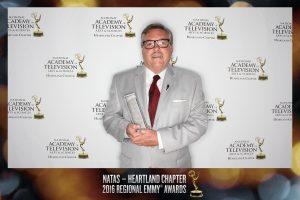 David Nelson, professor, Department of Communication, accepts an Emmy Award for "The Bluffs."