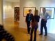 Caitlin Green, interim director, Gallery of Contemporary Art, explains the layout of exhibit space in the Plaza of the Rockies building to Andrea Cordova, executive assistant, Office of the Chancellor, and Tom Christensen, dean, College of Letters, Arts and Sciences.