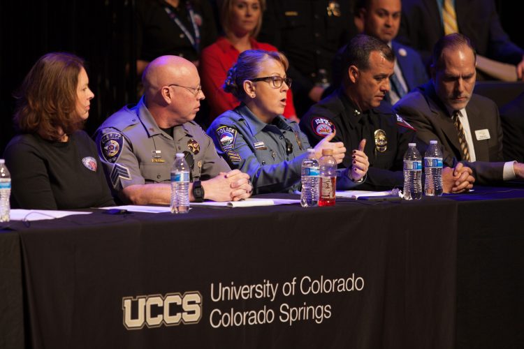 Panel discussion with police at a town hall event.