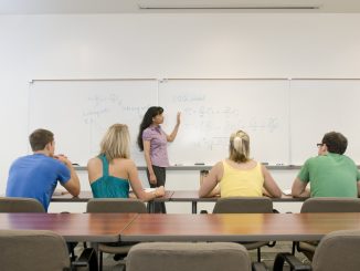A professor leading a small class.
