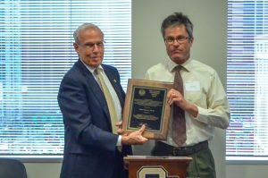 CU President Bruce Benson presents the Thomas Jefferson Award to John Harner