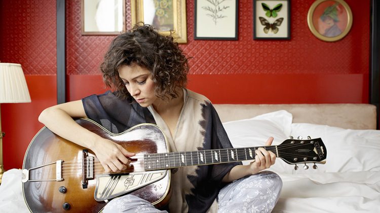 Gaby Moreno holds her guitar