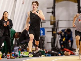 A sprinter competes at Mountain Lion Fieldhouse