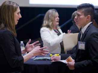 Business students meet with employers during the College of Business Career Networking Night