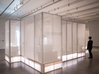 A person reviews a new art installation in the Gallery of Contemporary Art