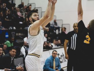 Blend Avdili shoots the ball against a Fort Lewis defender.