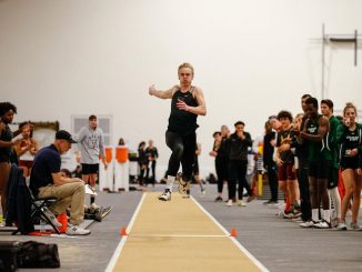 A jumper in midflight at Mountain Lion Fieldhouse.