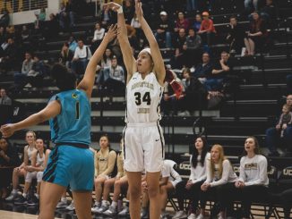 Madison Lord shoots the ball against a Fort Lewis defender.