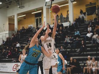 Ellie Moore shoots a layup against a Fort Lewis College defender.