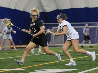 Audrey Napp with the ball being guarded by a Concordia-St. Paul defender