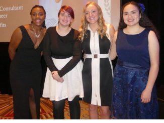 A group of people at an awards ceremony