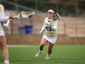 Maddie Ellis carries the ball down the field at Mountain Lion Stadium