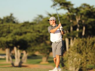Parker Scaling on the golf course after hitting the ball.