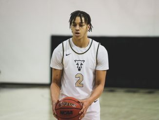 Alijah Comithier pauses before shooting a free throw in the Gallogly Events Center