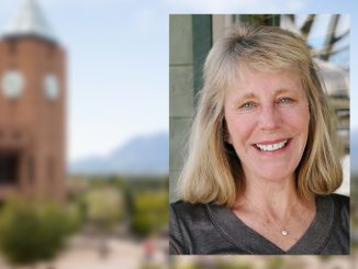 Headshot of Mary Ann Cutter with a faded image of the campus clock tower in the background