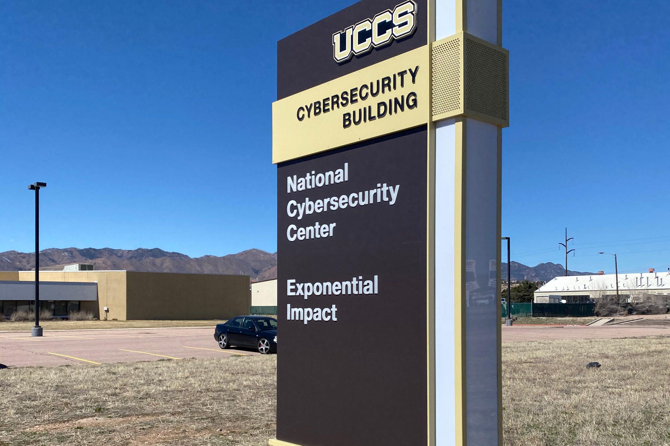The exterior sign in front of the UCCS Cybersecurity Building.