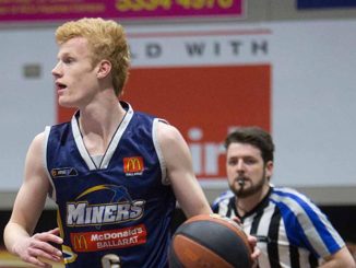 Jeremiah "Jezza" McKenzie dribbles the basketball during a game