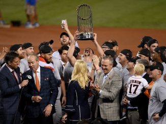 The Houston Astros celebrate with the World Series trophy