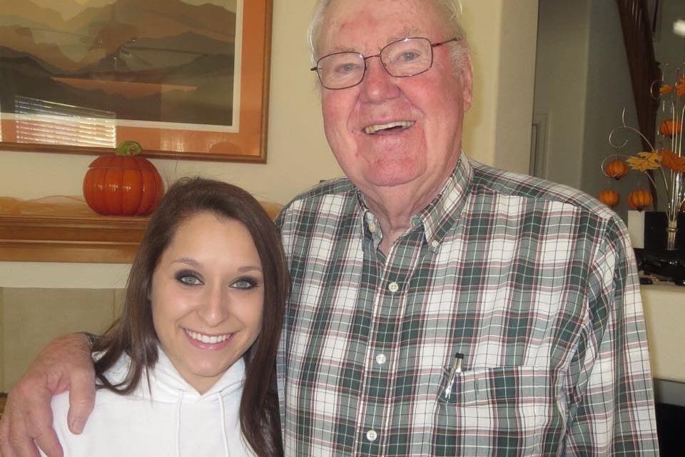 Meagan Tracey stands next to her grandfather, James.