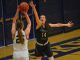 Ellie Moore goes for a shot block against a South Dakota School of Mines shooter