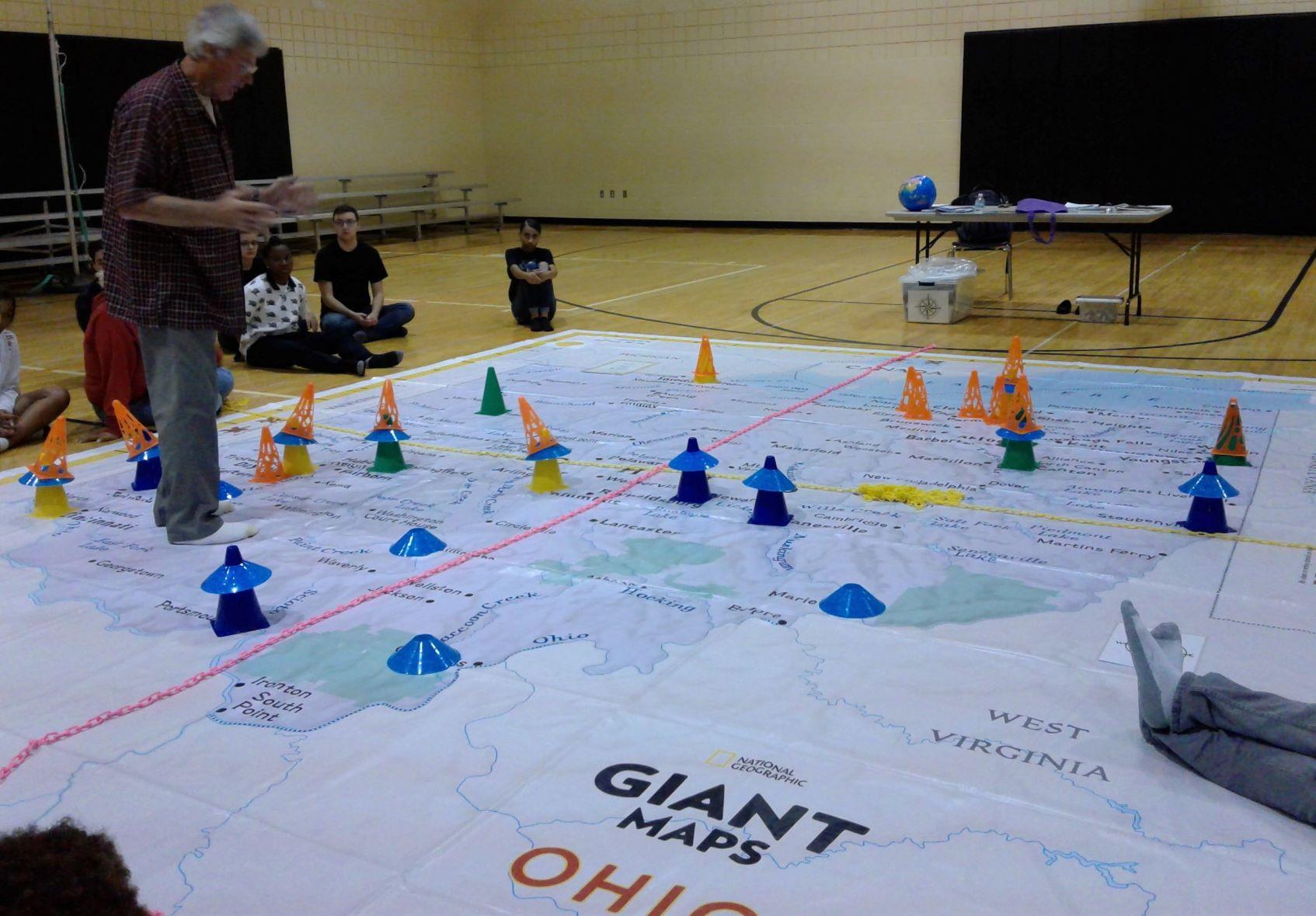 A teacher using the Giant Map of Ohio during a class