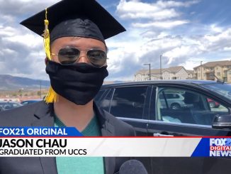 Jason Chau wearing his mortarboard and a face covering outside