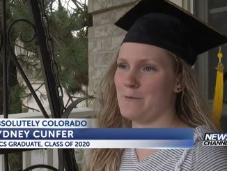 Sydney Cunfer wearing her mortarboard while sitting on the front porch.
