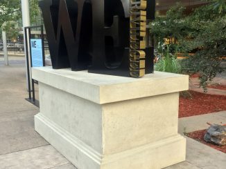 Sculpture that says "We the privileged"