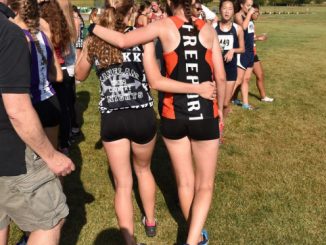 Two cross country runners after a race