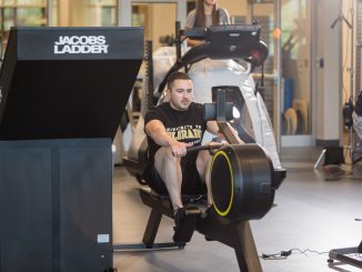 A person using a rowing machine in the Hybl Sports Medicine and Performance Center