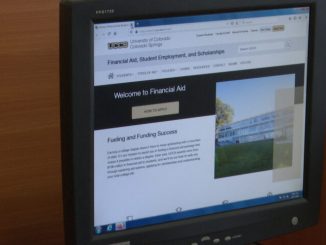 A computer screen with the financial aid website